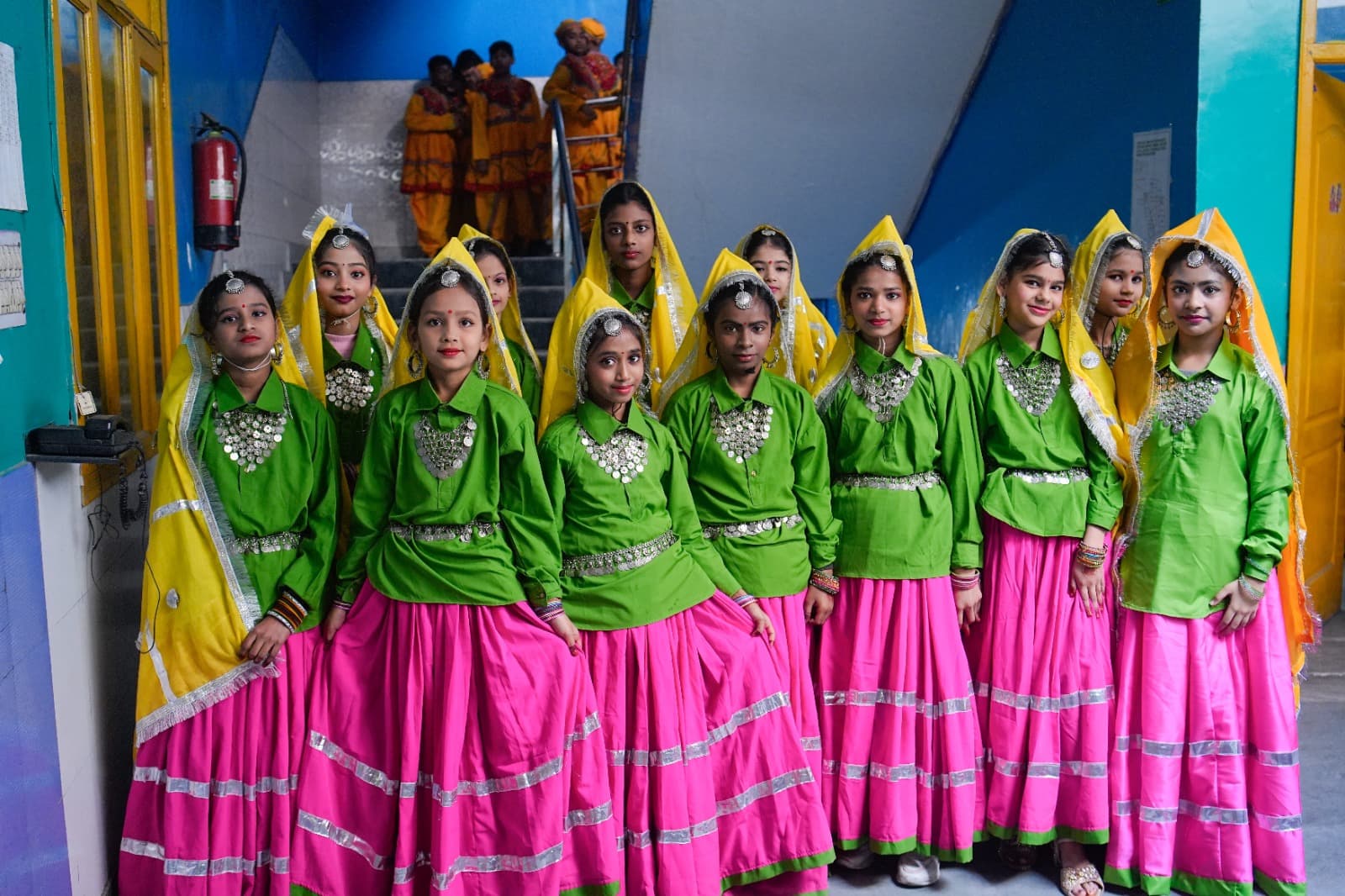 Group dance in green costume